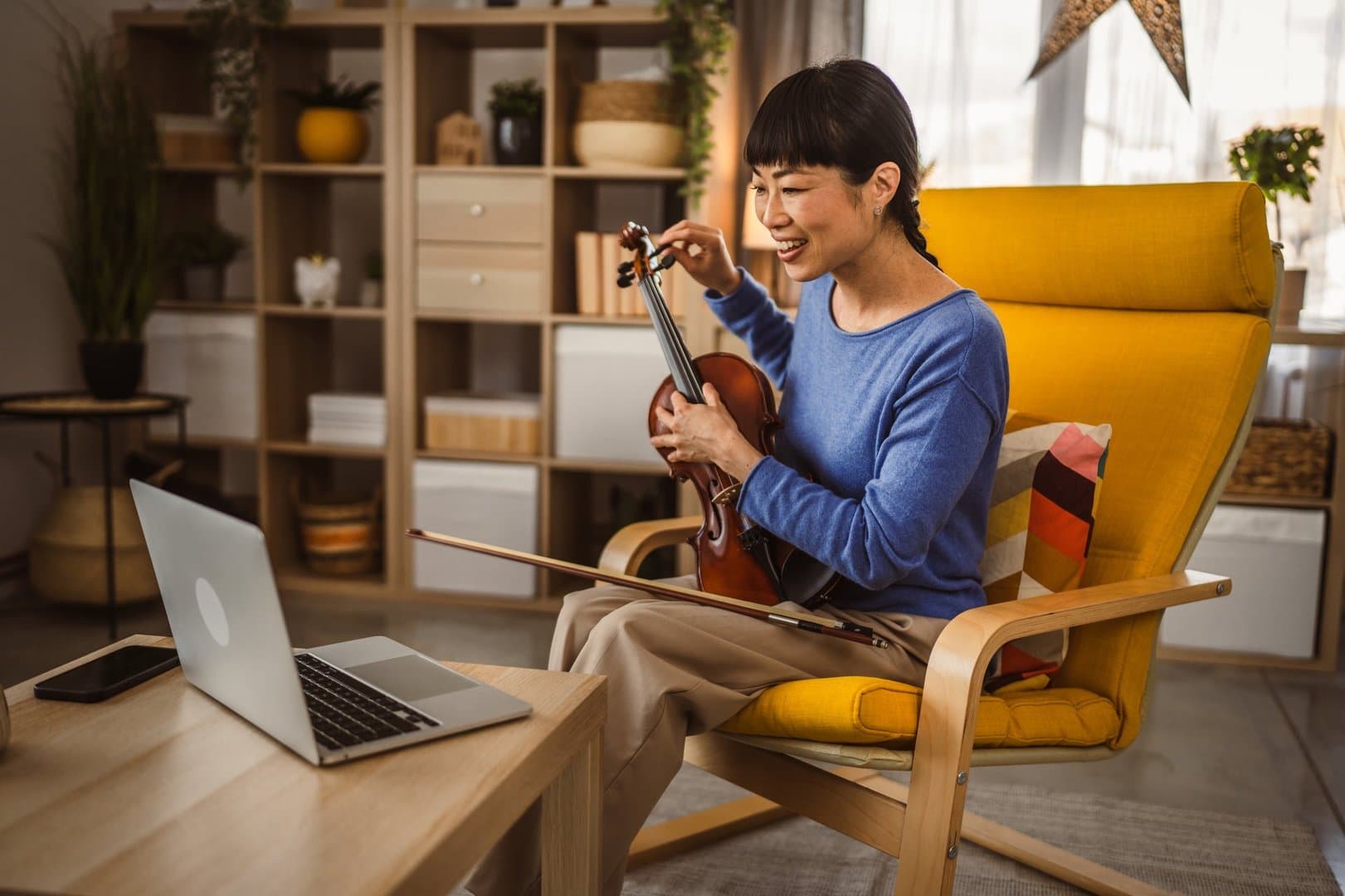 Mature japanese woman have online class learn how to play violin